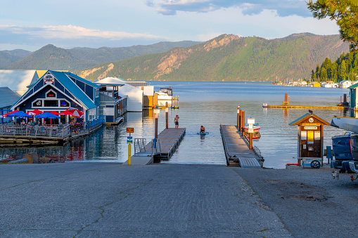 Wooden docks jut into the scenic bay at the marina on Lake Pend Oreille, with boat houses, cafes and float homes nearby in Bayview, Idaho.
