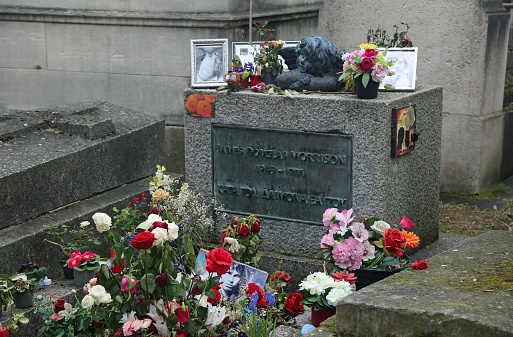 The tombstone of famous rock band The Doors singer - Jim Morrison in Pere Lachaise cemetery in Paris, France