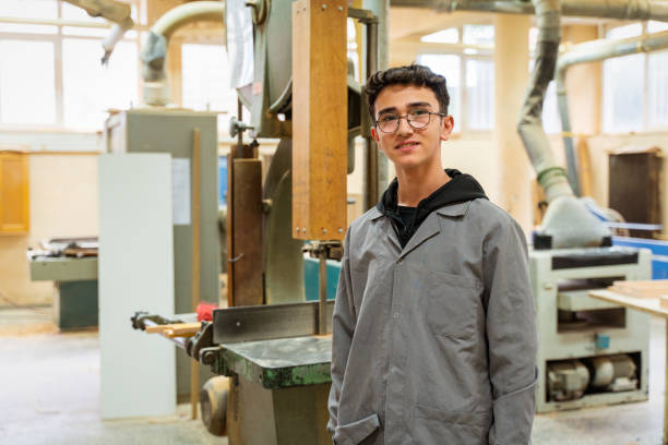 istock Portrait of Carpentry Workshop With Students Studying For Apprenticeship At High School 1496190718