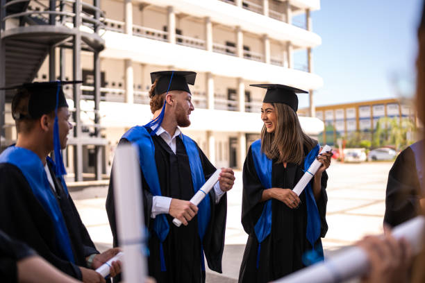 istock Young graduates friends talking on their graduation 1496191801