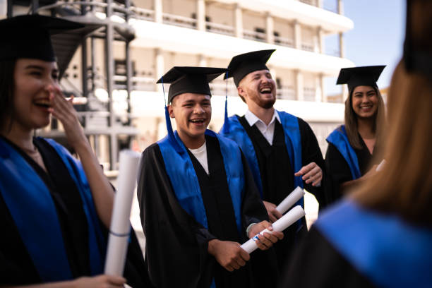 istock Young graduates friends talking on their graduation 1496191835