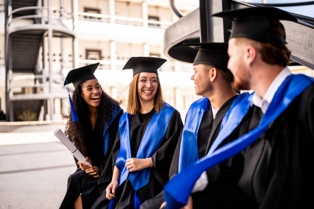 Young graduates friends talking on graduation