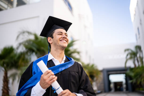 istock Young graduate man contemplating on his graduation 1496192497