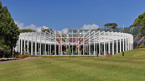 The Calyx in the Royal Botanic Garden-Lower Palace Garden section: circular colonnade alike the sepals that enclose a flower petals, built onto the quarter-circle Arc glasshouse. Sydney-NSW-Australia.
