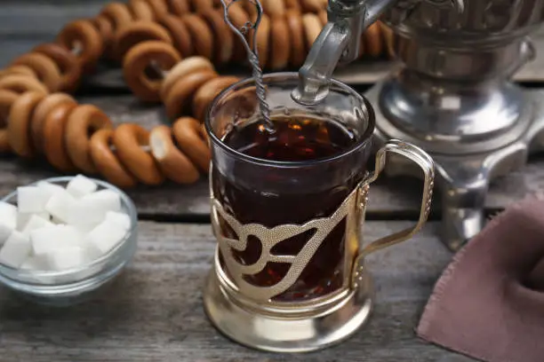 Cup of tea with delicious ring shaped Sushki (dry bagels) on wooden table