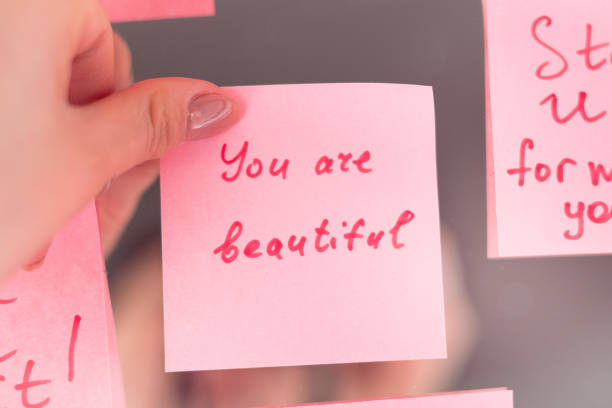 istock inspirational quotes on pink sticker on the mirror,handwriting text 1496196625