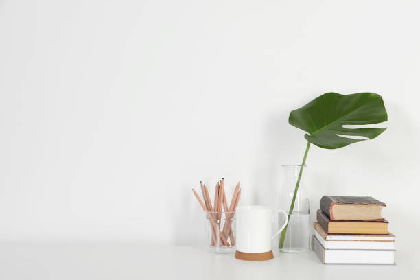 istock Comfortable workplace with white desk near wall at home 1496197427