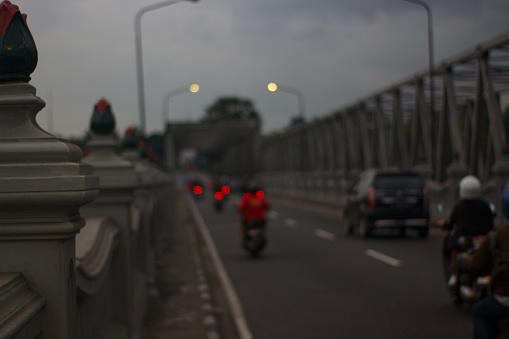 A pair of busy inter-provincial crossing bridges are passed by motorbikers and four-wheeled riders every day