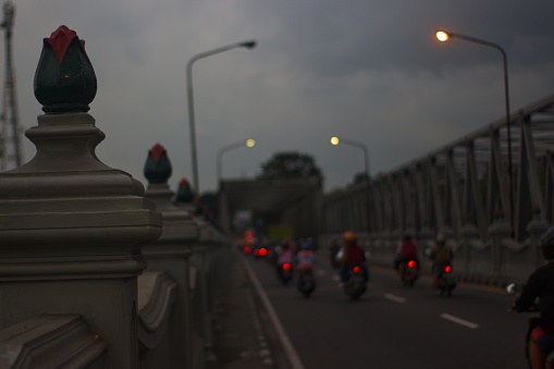 A pair of busy inter-provincial crossing bridges are passed by motorbikers and four-wheeled riders every day