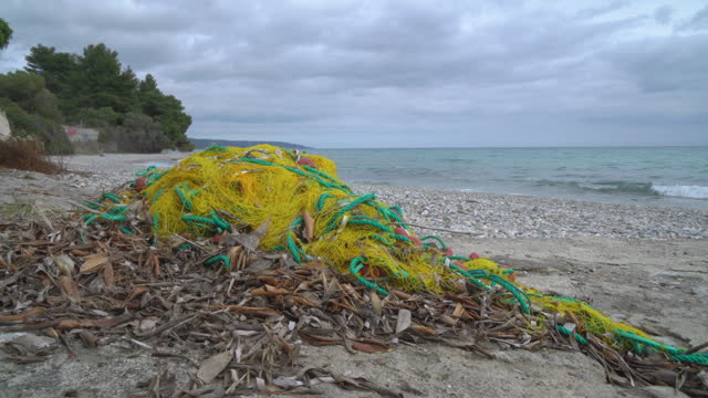 Garbage on the beach an abandoned fishing net