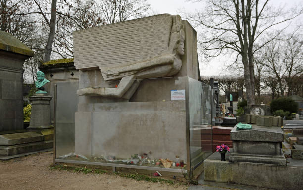 The tombstone of famous Irish poet Oscar Wilde in Pere Lachaise Cemetery in Paris, France