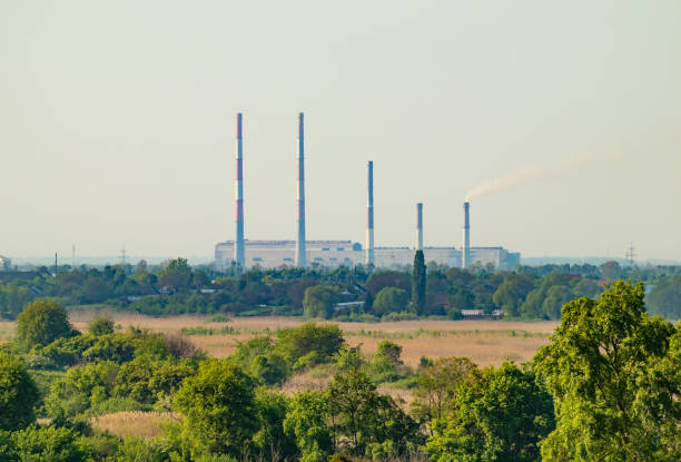 istock Large thermal power plant with tall chimneys on the horizon 1496203522