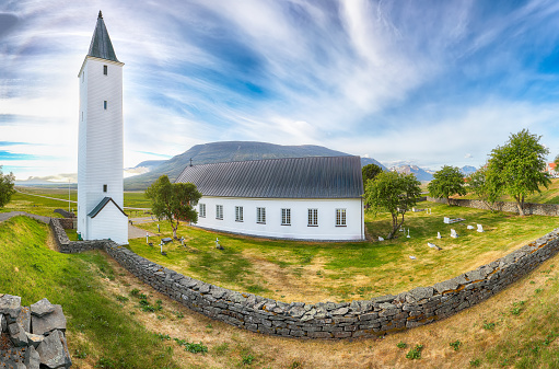 Country side, small church under the Saltstraumen Bridge in the fjord Saltfjorden in Bodo territory in Nordland country, Norway. There is a small strait with one of the strongest tidal currents with whirlpools or Vortices in the world.