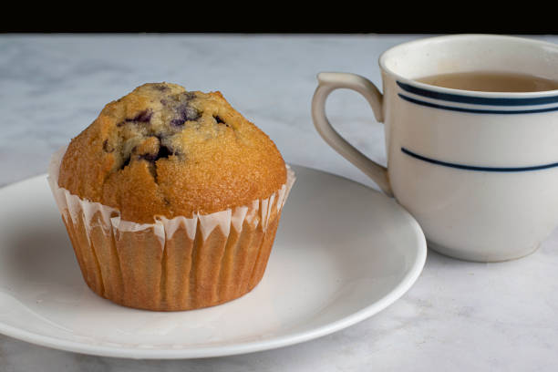istock blueberry muffin  with a fresh cup  of tea 1496217676