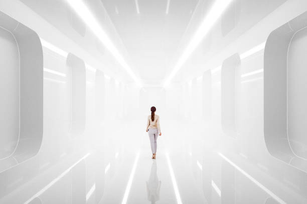 istock Woman walking in futuristic corridor 1496221171