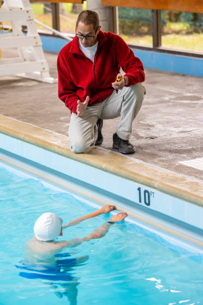 istock Father and Son Swimming and Coaching 1496221942