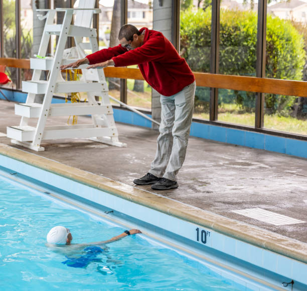 istock Father and Son Swimming and Coaching 1496221977