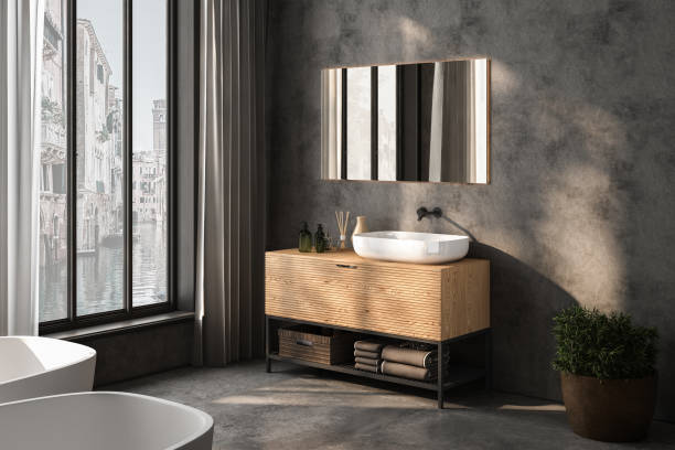 istock minimalist bathroom interior, concrete floor and wall, bathroom cabinet, bathtub. 3d Rendering 1496225941