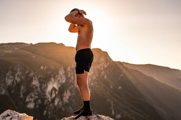 istock An athlete rests on top of a mountain after exhausting running training. 1496226631