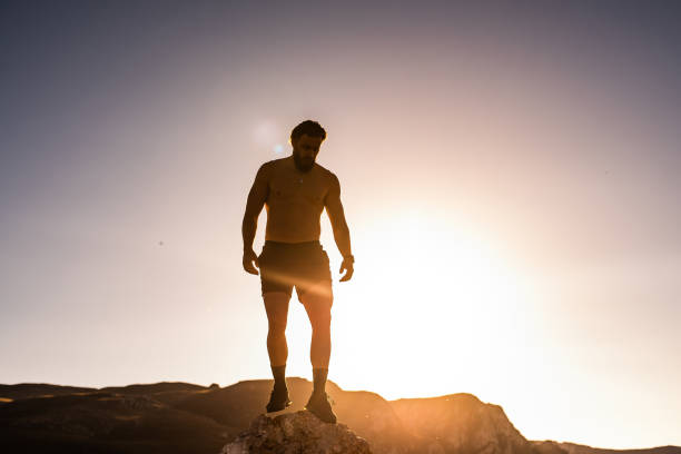 istock An athlete rests on top of a mountain after exhausting running training. 1496227066