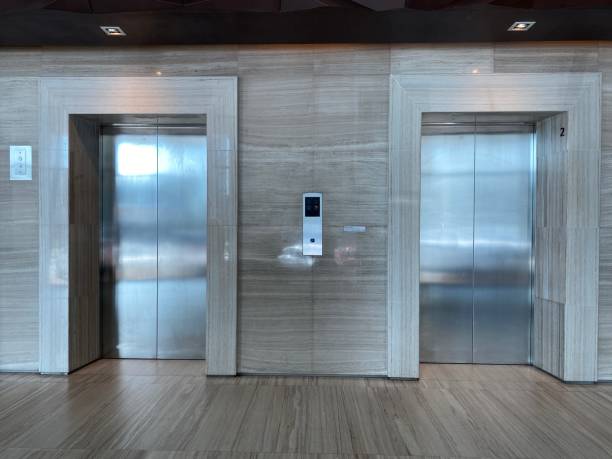 istock Two brushed metal elevator doors in a minimalistic style building interior 1496228631