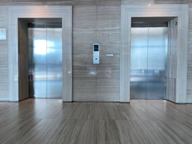 istock Two brushed metal elevator doors in a minimalistic style building interior 1496228636