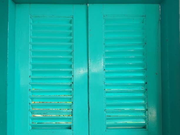 vintage shutters on the green color. authentic from betawi style, indonesia