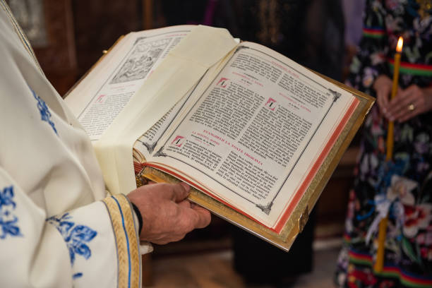 istock priest's hands over the gospel 1496235540