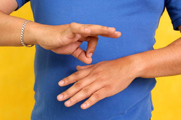 istock Hands of a Latino man makes sign language, expression and gesture-spatial configuration and visual perception with which deaf people establish a channel of communication 1496235677