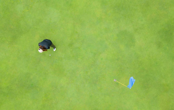istock Direct above view of golfer on putting green 1496247506