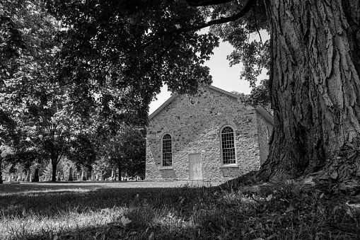 St. Andrew's Presbyterian Church, or simply the Old Stone Church near Beaverton, Ontario, was built between 1840 and 1853. Black and white.