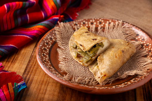 Quesadilla de Comal con queso y Nopales. Typical Mexican quesadilla made on a comal, very popular dish, one of the main street food in Mexico.