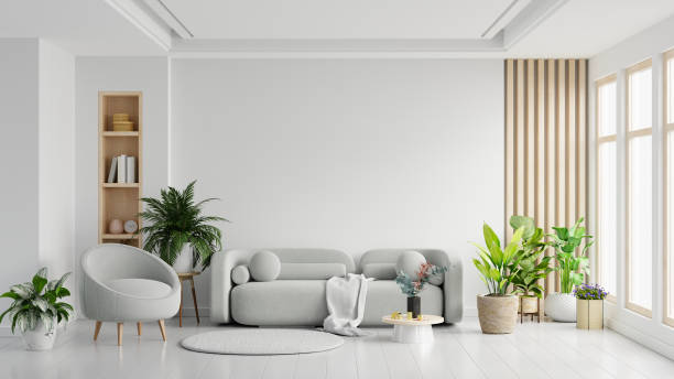 istock Modern minimalist interior, featuring an elegant armchair and sofa set against a pristine white wall background. 1496261385