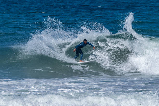 istock Surfer riding waves in Furadouro Beach 1496261654
