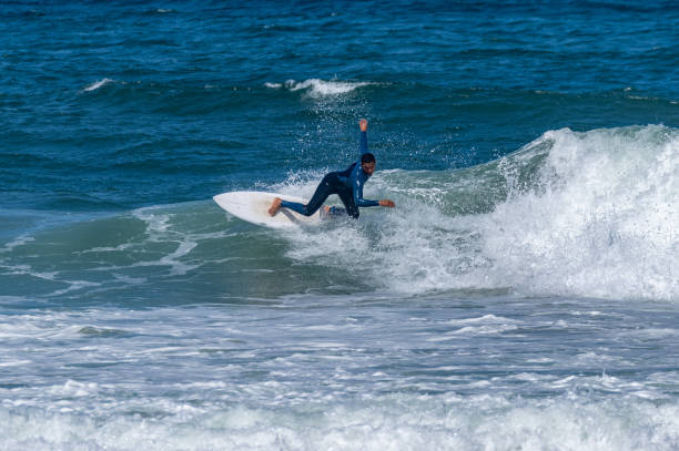 istock Surfer riding waves in Furadouro Beach 1496261679
