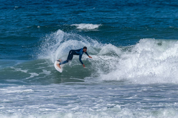 istock Surfer riding waves in Furadouro Beach 1496261723