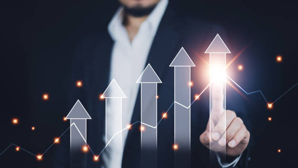istock Businessman pointing arrow graph corporate future growth plan, Business development to success and growing growth concept,  finance and banking, marketing, strategy and planning to corporate. 1496264809