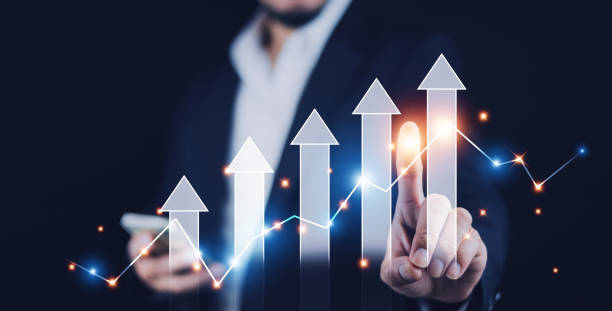 istock Businessman pointing arrow graph corporate future growth plan, Business development to success and growing growth concept,  finance and banking, marketing, strategy and planning to corporate. 1496264817