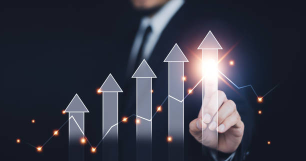 istock Businessman pointing arrow graph corporate future growth plan, Business development to success and growing growth concept,  finance and banking, marketing, strategy and planning to corporate. 1496264823