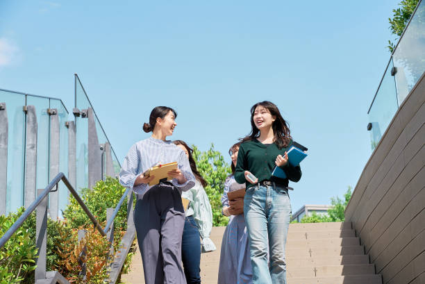 istock Four young women walking together 1496267577