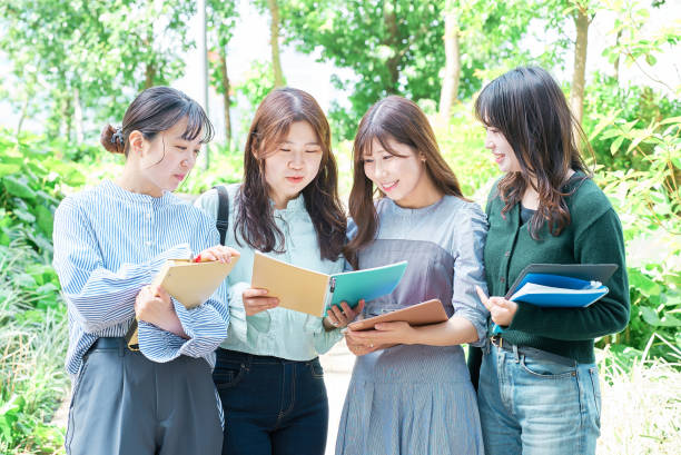 istock Four young women smiling outdoors 1496267823