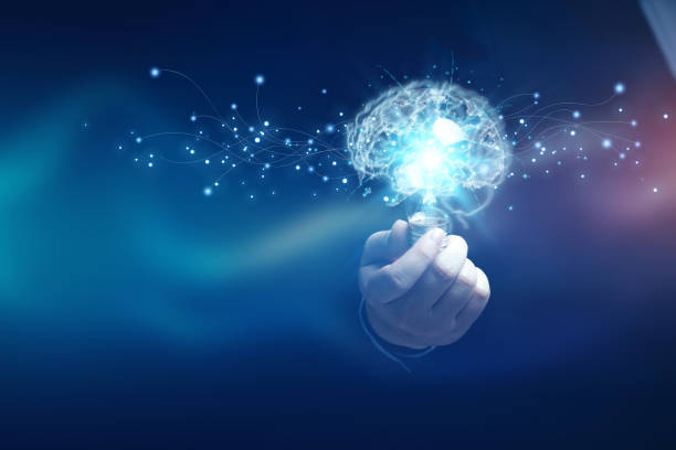 istock New ideas and imagination. A human holding a light bulb with brain shape of artificial intelligence. 1496268902