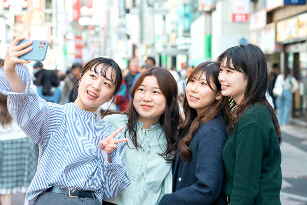istock Four women taking selfies in the city 1496268976