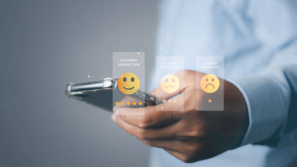 istock Man using phone giving high score for feedback review satisfaction service. 1496269871