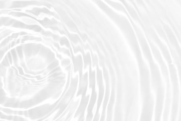 istock White water with ripples on the surface. Defocus blurred transparent white colored clear calm water surface texture with splashes and bubbles. Water waves with shining pattern texture background. 1496270133