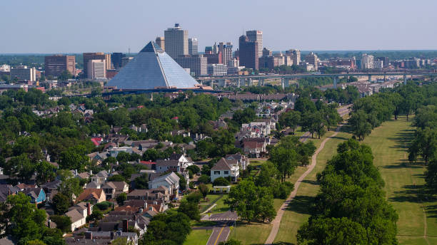 Harbor Town cityscape with residential houses in front of Memphis Pyramid - view to Downtown business district, Memphis, Tennessee — aerial view. stock photo