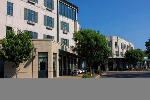 istock Apartment multistory building on blue sky view in Memphis. Apartment complex and restaurant along the street in Harbor Town, Memphis, TN 1496277401