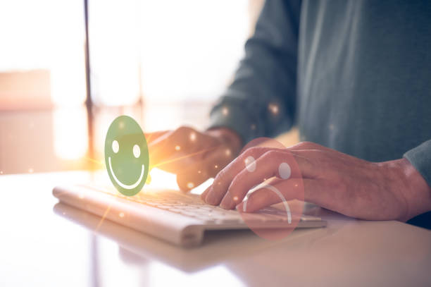 istock Customer service satisfaction survey concept.Business people or customers show satisfaction by pressing face emoticon smile in satisfaction on virtual touch screen. 1496277457