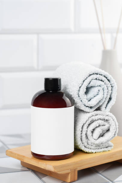 istock Bath foam bottle mockup for packaging. In bathroom. Place for text and logo. 1496280682