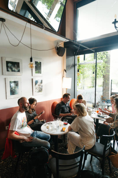 istock Group of friends in a cafe 1496282045